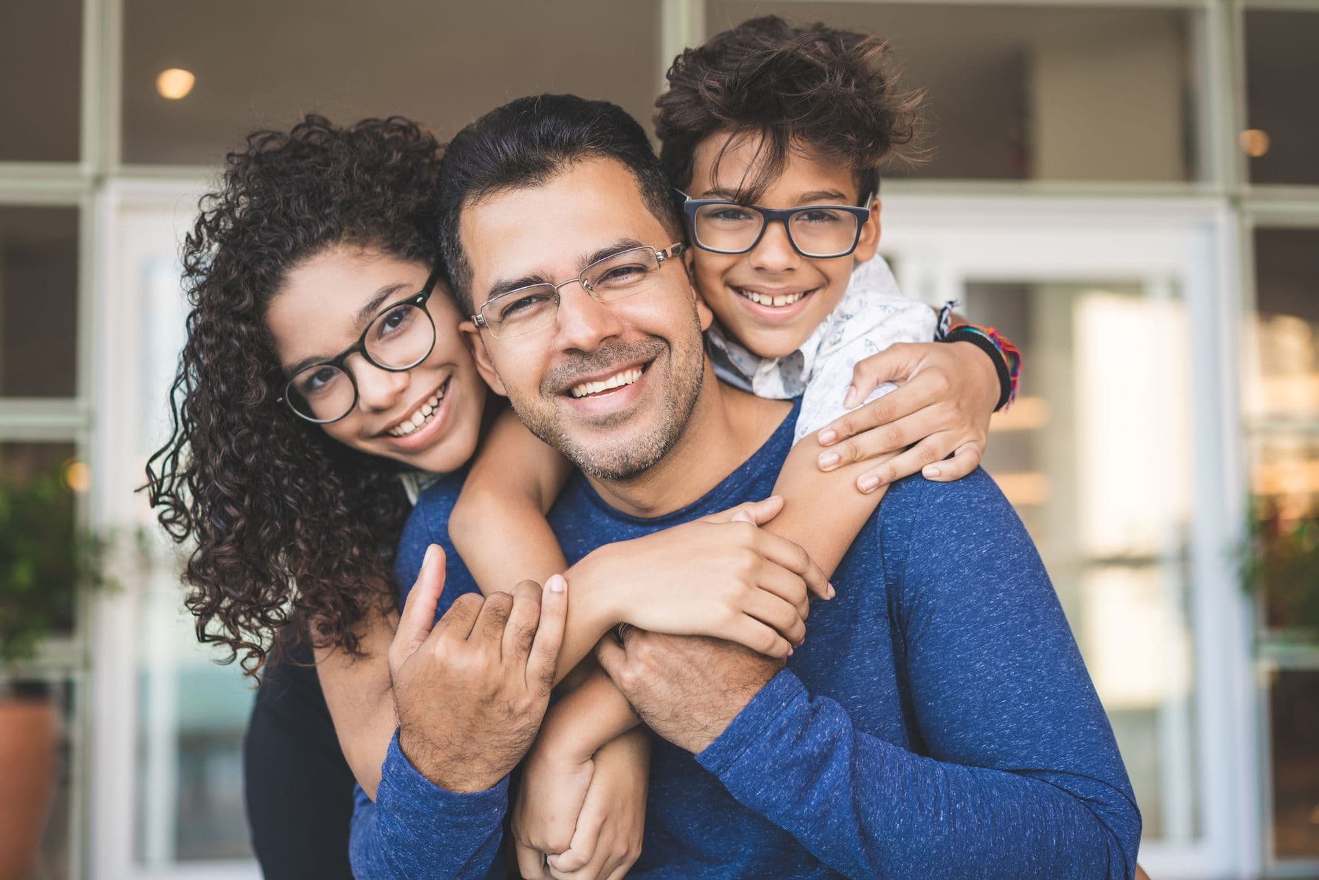 Family with father wearing new glasses